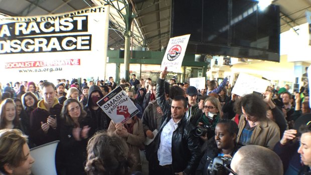 Protesters at Flinders St station rally against Border Force.
