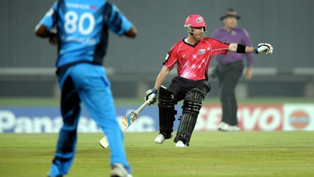 Sydney Sixers batsman Brad Haddin runs between the wickets on October 26, 2012 during a semi-final Champions League T20 (CLT20) match against the Sydney Sixers at the SuperSport Park in Centurion.