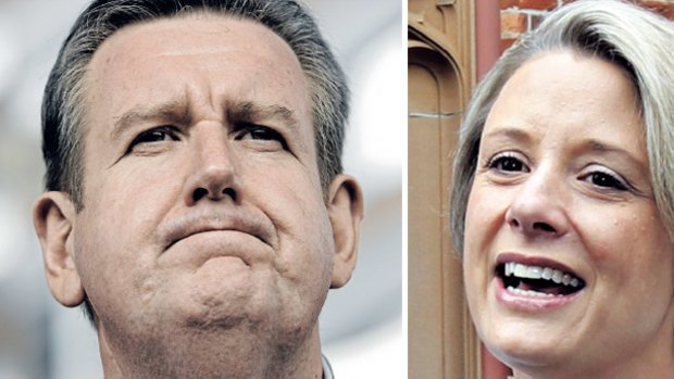 The morning after: the enormity of his landslide win over Kristina Keneally (right) appears to finally dawn on NSW premier-elect Barry O'Farrell.