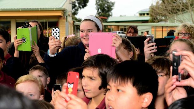 Students take pictures of the  Prime Minister during his visit to Brentwood Park Primary School in Berwick, Melbourne.