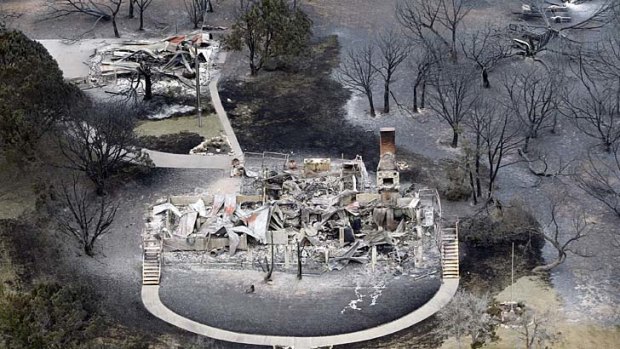 "The deadly European heatwave of 2003, the fiery Russian heatwave of 2010 and catastrophic droughts in Texas and Oklahoma last year can each be attributed to climate change" ... the remains of a house at Possum Kingdom Lake, Texas, in April 2011.