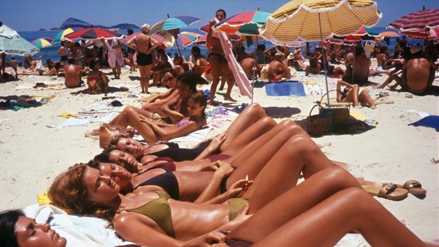 Phone free: girls sunbake on the beach in Rio during the 1990s.