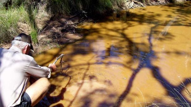 A waterhole contaminated with heavy oil slick - allegedly from coal seam gas exploration on the Western Downs between Tara and Chinchilla.
