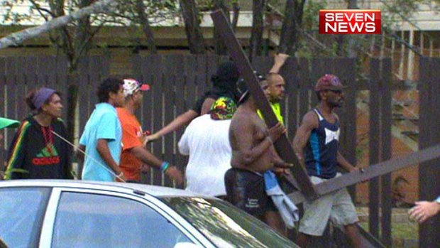 Men have wielded fence palings as weapons in a face-off between Aboriginal and Pacific Islander groups in Logan.