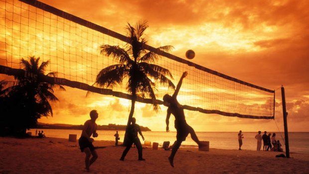 Someone's got to do it: A volleyball game at Tumon Bay.