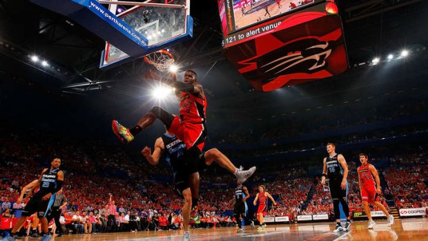 Sending a message: James Ennis of the Perth Wildcats gives the Perth Arena something to cheer about.