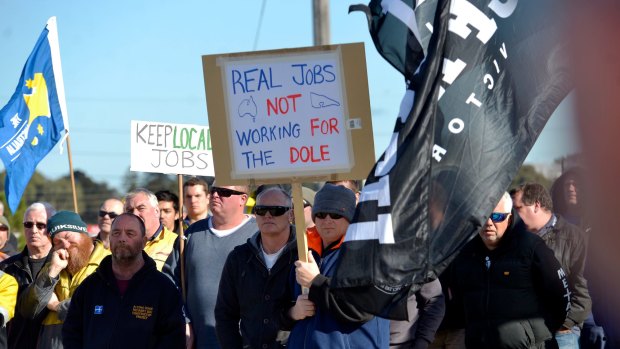 Workers rally at Webb Dock on Tuesday.
