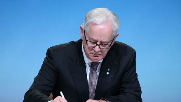 Minister of Trade and Investment Andrew Robb signs the Trans Pacific Partnership on Thursday.