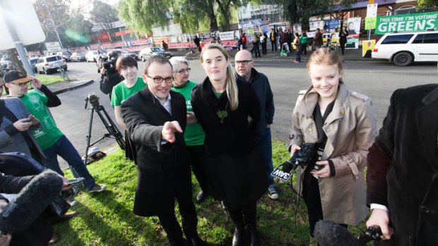 Greens candidate Cathy Oke with the party's deputy leader Adam Bandt as voters head to cast their votes in yesterday's byelection for the seat of Melbourne.
