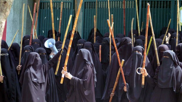 Identity checks: Students in Islamabad chant slogans during a 2007 protest in support of their teachers.