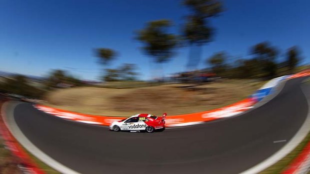 Speedy: Craig Lowndes practises for the Bathurst 1000 at Mount Panorama yesterday.