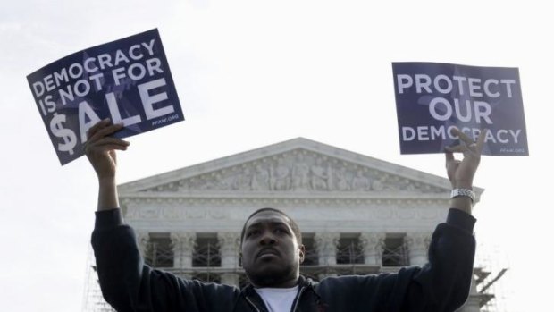 Divisive: Protesters outside the US Supreme Court as it heard arguments about political donations.