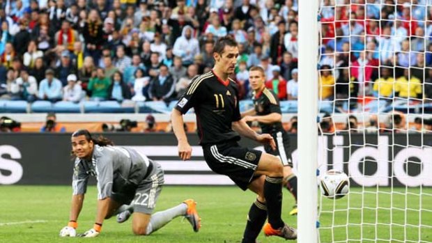 Germany's Miroslav Klose scores his team's second goal.