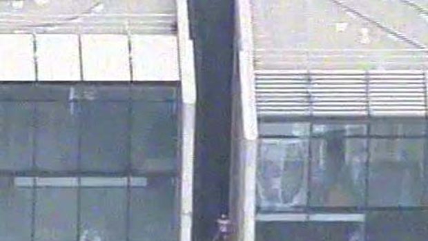 Alain Robert climbed the 57-storey Lumiere building on Bathurst Street.