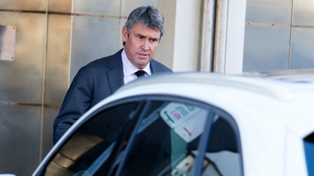 David Gyngell leaves James Packer's Bondi Beach home on Monday morning.