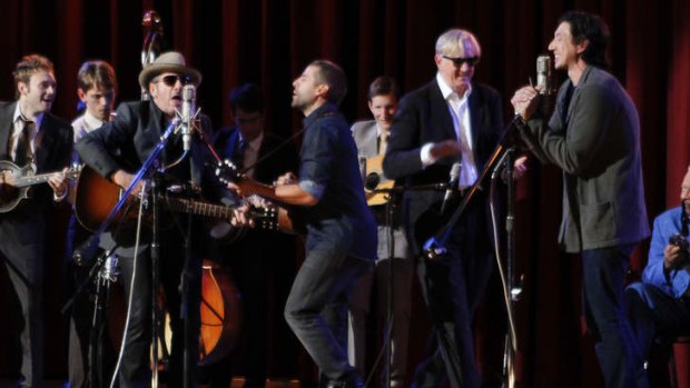 Celebration: Elvis Costello, T-Bone Burnett, Oscar Isaac and Adam Driver.