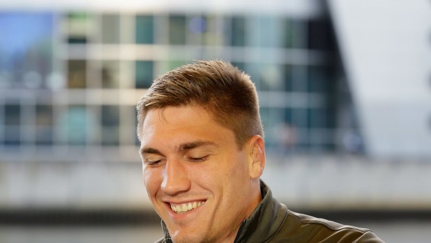 Sean McMahon signs autographs at a Wallabies fan day in Melbourne.