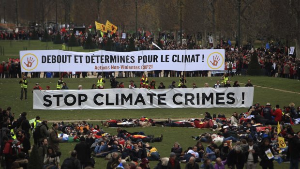 Activists gather during a demonstration on the final day of the conference.