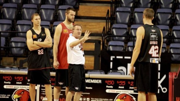 Wollongong Hawks players Tim Coenraad, Larry Davidson, coach Gordie McKeod and Dave Gruber at training.