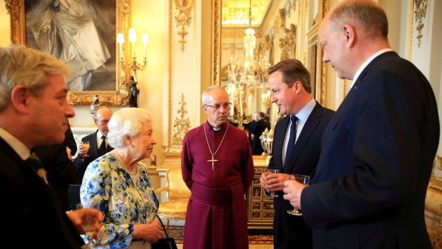 LONDON, ENGLAND - MAY 10: Queen Elizabeth II speaks with Prime Minister David Cameron (2nd R), as Chris Grayling (R), leader of the House of Commons and Archbishop of Canterbury Justin Welby (C) look on during a reception in Buckingham Palace to mark the Queen's 90th birthday on May 10, 2016 in London, England.  (Photo by Paul Hackett - WPA Pool / Getty Images)