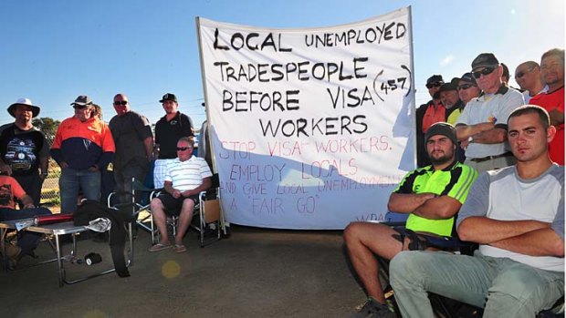 Out of work tradies picket against the use of 457 visa workers.