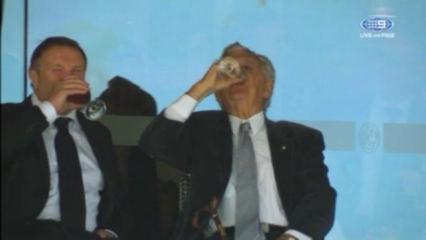 Former Australian Prime Minister Bob Hawke skols a beer at the cricket on Wednesday.