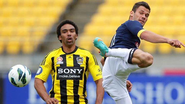 You do it like this &#8230; the Mariners' Pedj Bojic passes in the air while Phoenix's Paul Ifill can only look on.