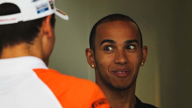 The good old days ... Lewis Hamilton, right, shares a joke with Adrian Sutil at the Shanghai International Circuit, hours before the incident at a nightclub.