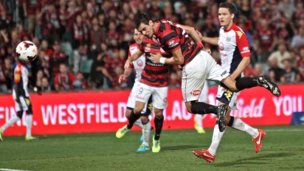 Tomi Juric scores the winner with a diving header.