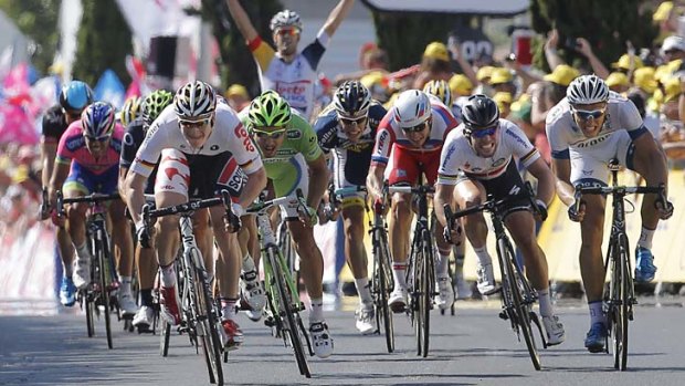 Beaten to the line: Andre Greipel sprints to vicotry ahead of Mark Cavendish, second right.