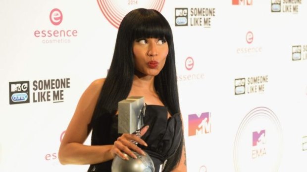 Winner: Nicki Minaj poses backstage with her Best Hip Hop trophy during the MTV EMAs, which she also hosted.