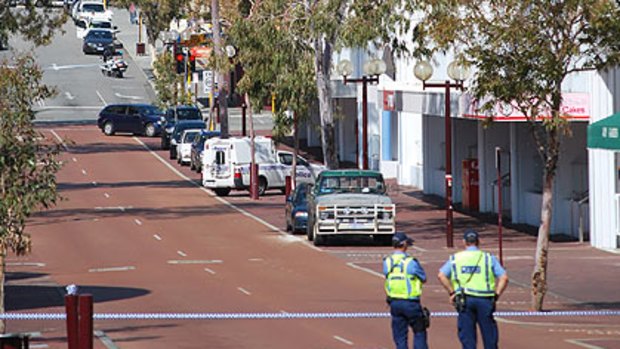 Police man a cordon along Francis Street, outside the ATO headquarters.