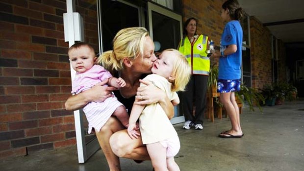 April Pearce with daughters Lillith and Anita Grbin at the Red Cross emergency accommodation centre in Dalby. Red Cross worker Jessie Maher and Arianda Troutman are in the background.