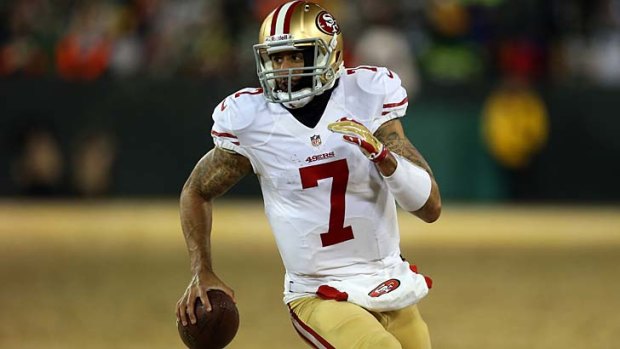 Colin Kaepernick runs the ball for a first down in the fourth quarter.