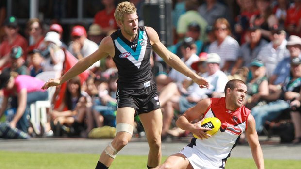Melbourne's James Sellar takes a mark in front of Jackson Trengove.
