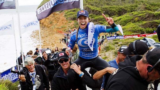 Maiden voyage: Sally Fitzgibbons enjoys the luxury of being chaired up the Bells Beach steps after her first win on the pro tour.