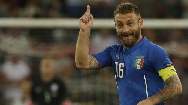 On target: Daniele De Rossi celebrates after scoring for Italy.