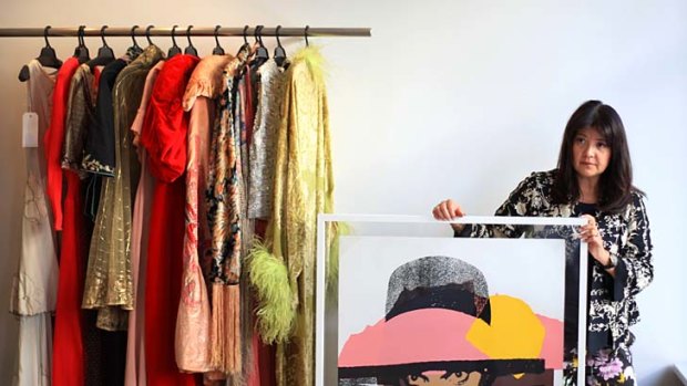 Everything must go &#8230; Lisa Ho with some of the garments she is selling at auction, as well as a print by Andy Warhol.