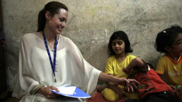 Goodwill ambassador...Angeline Jolie with Iraqi refugee children in Damascus, Syria.