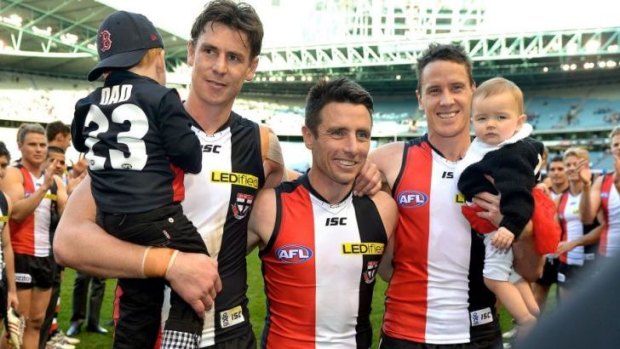 Justin Koschitzke walks off Etihad with fellow retirees Stephen Milne and Jason Blake