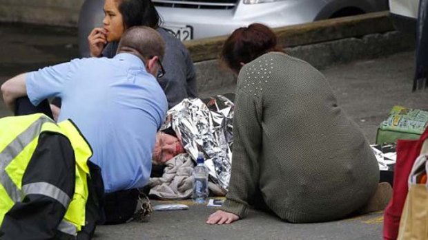 A woman is comforted in Wellington after an earthquake that struck New Zealand.