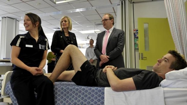Physiotherapy students Kylie Murray and Sam Wood talk to ACT Chief Minister Katy Gallagher and University Vice Chancellor Professor Stephen Parker about the signing of the agreement for the new northside hospital yesterday.