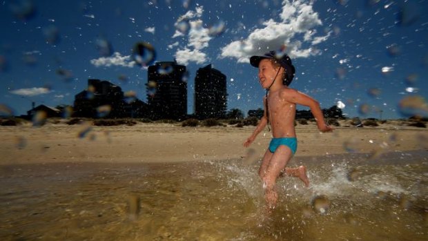 Angus Debien laps it up at Port Melbourne Beach. Last year, the beach — along with many others — failed to meet the EPA's water quality targets after a season of heavy summer rain.