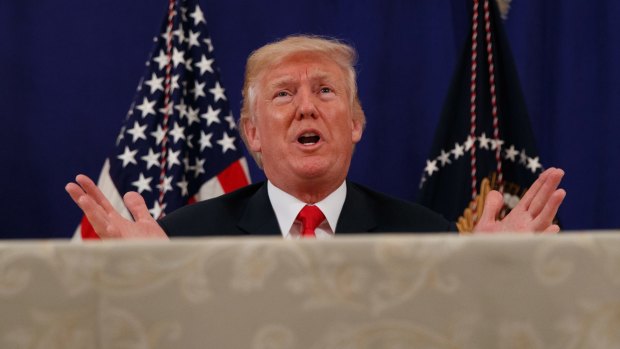 US President Donald Trump speaks to reporters after a security briefing at Trump National Golf Club in Bedminster, New Jersey.