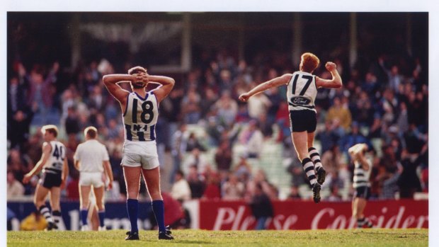 Tim McGrath celebrates the after-the-siren goal by Gary Ablett while North Melbourne's Wayne Carey looks on.