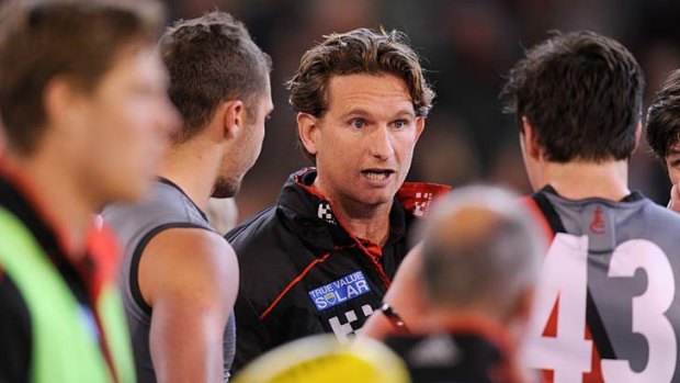 James Hird urges his players on at quarter-time.