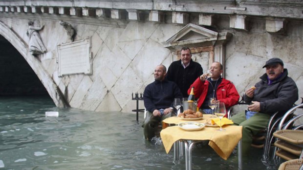 Water in Venice is nothing new .... gondoliers eat breakfast while sitting in flood waters.
