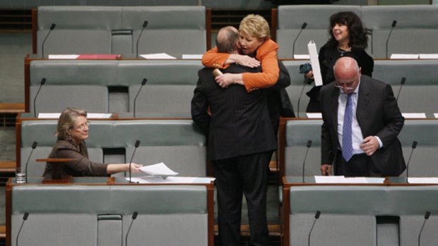 "God forgive me that I was part of that parliament that did that"...Julia Irwin congratulates Russell Broadbent after his speech yesterday watched by Judi Moylan, left, Danna Vale and Petro Georgio.