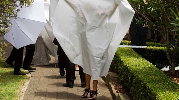 Covert operation ... the bride is shielded.