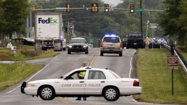 Police respond to the shooting on Tuesday morning at the FedEx hub in Kennesaw, Georgia.